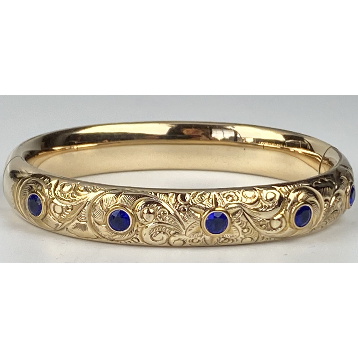 Deeply Engraved Engagement Bangle with Deep Blue Stones