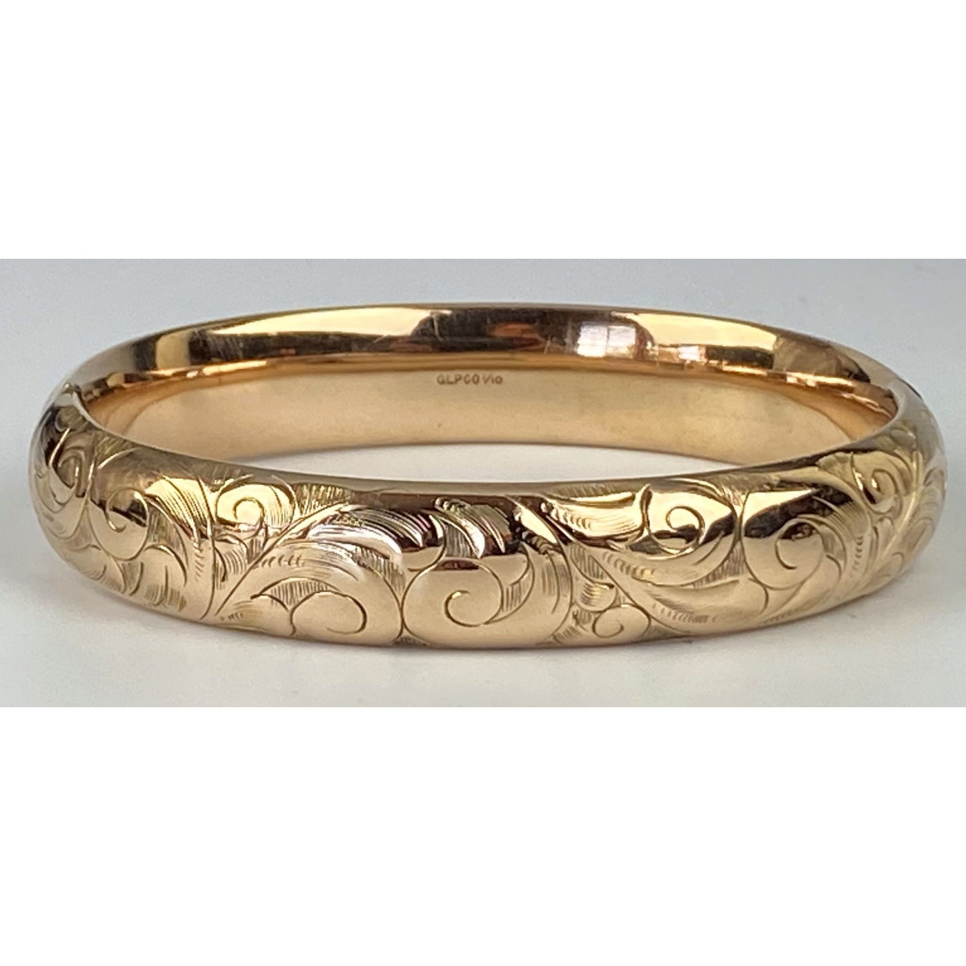 Deeply Engraved Swirls Highly Domed Engagement Bangle